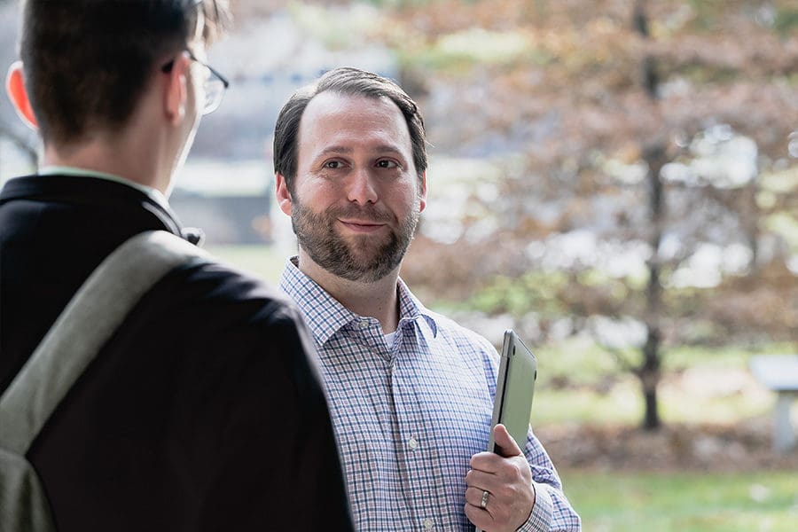 Professor talking to student