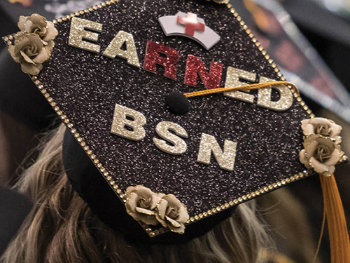 A graduation cap decorated to read "Earned BSN"