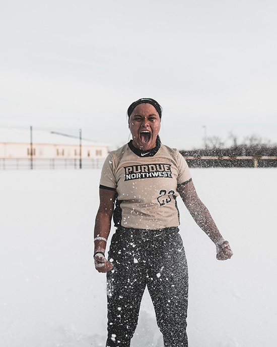 PNW softball player Kyleigh Payne celebrates in the snow