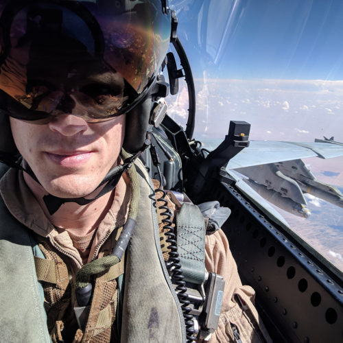 john tonkovich in the cockpit of a F/A-18 Super Hornet with sky in background