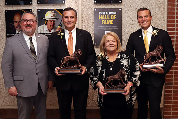 PNW Chancellor Holford Poses with 2024 Alumni Hall of Fame inductees Hammond Mayor Thomas McDermott Jr., the Honorable Diane Kavadias Schneider and Jeff Strack, president and CEO of Indiana Grocery Group