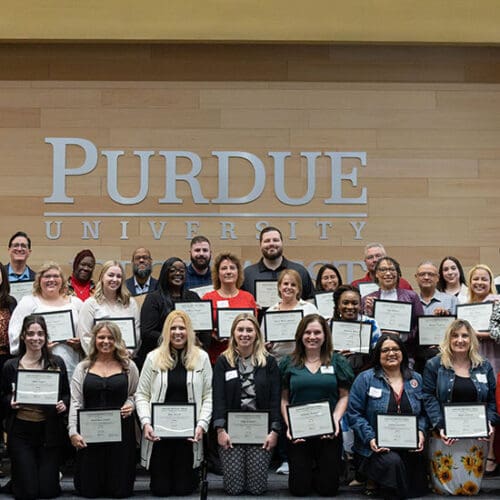 38 people pose with certificates after finishing the Leadership Northwest Indiana program.