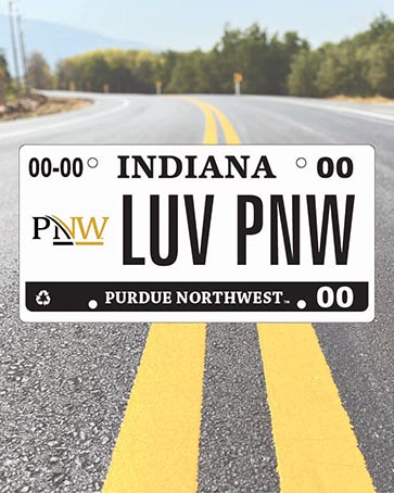 A license plate with the PNW Logo on it. The plate numbers read "LUV PNW," and it is superimposed on a road-and-sky background.