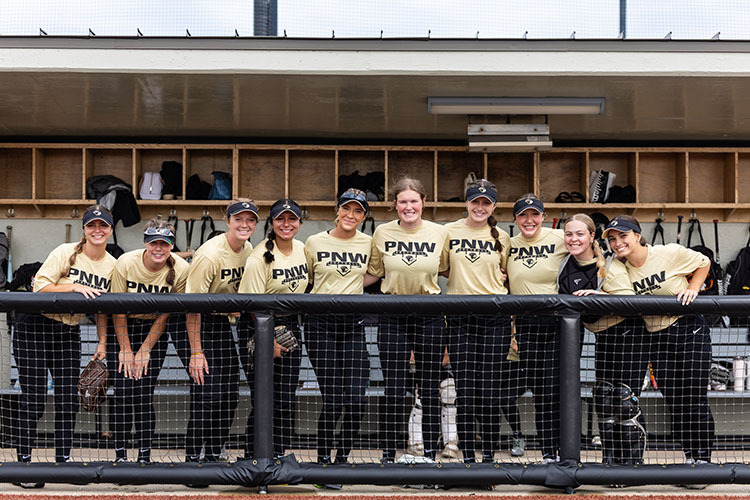 The PNW softball team in the dugout.