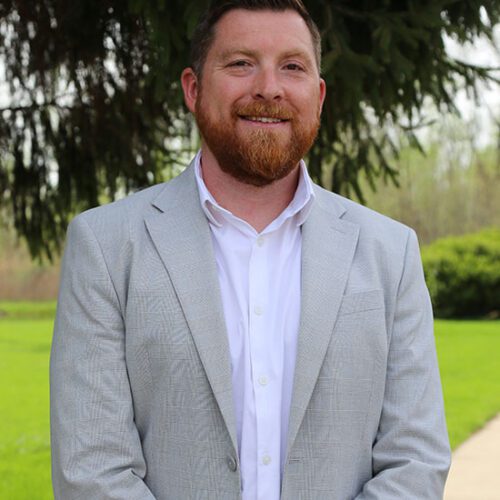 Bryan Cheek poses outdoors.