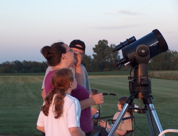 Students around telescope