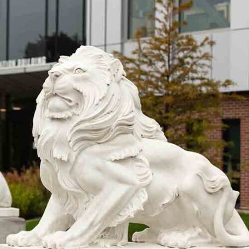 Statues of lions in front of Purdue University Northwest's NILS building.