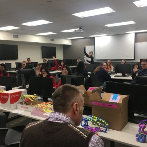 PNW associate professor of Biological Sciences Scott Bates, foreground, and assistant professor of Biological Sciences Lindsay Gielda, background, lead the “Protein Modeling” activity during the 2020 Regional Science Olympiad Tournament.