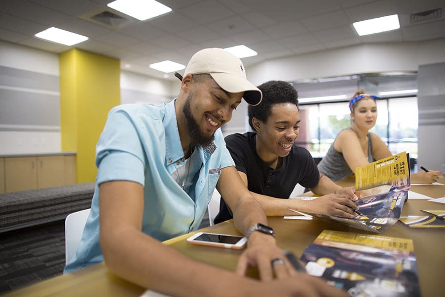 Students work together in the classroom.