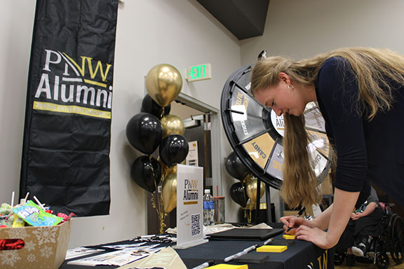 Students participating in Signing Day, Fall 2024. A student during signing day