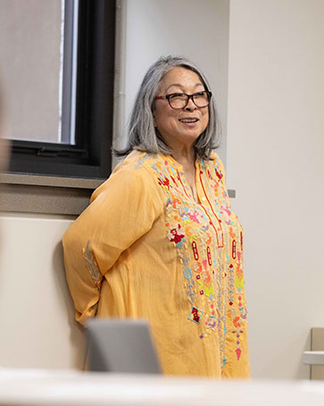 A Professor stands in front of a class