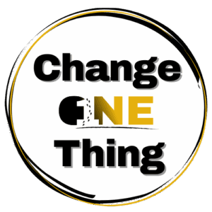 Change One Thing Logo is the words Change One Thing in a black and gold circle