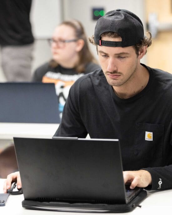 Student working on laptop computer