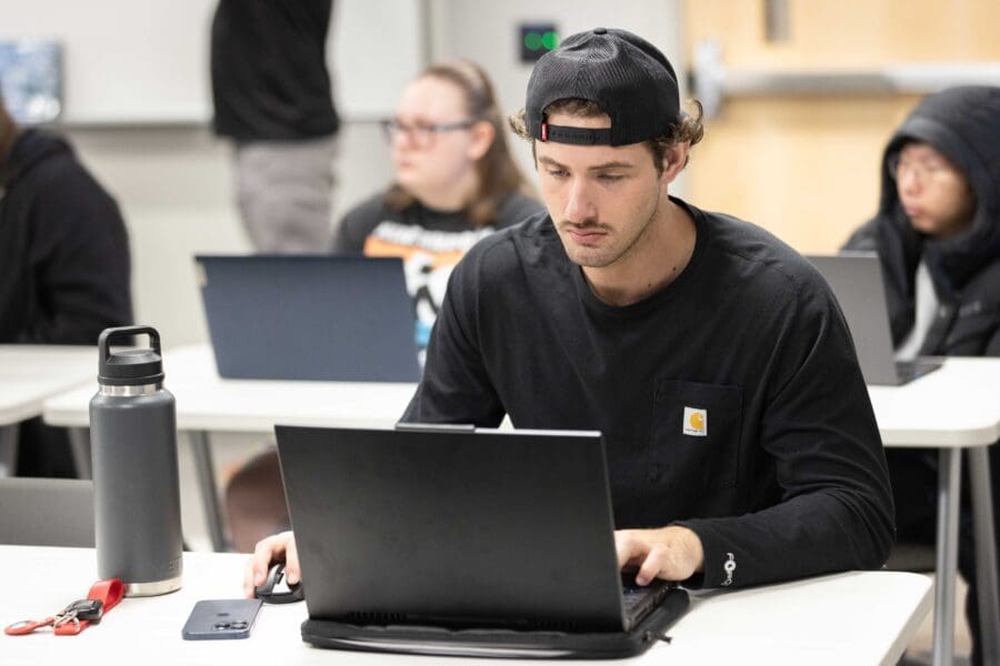 Student working on laptop computer