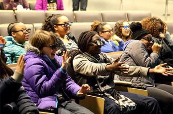 Girl Scouts enjoy a VR demo.