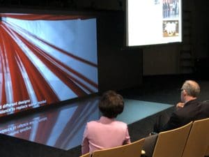 Professor Chenn Zhou sits with Congressman Visclosky and looks through a highlight video of CIVS projects