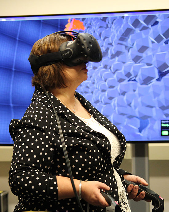 Violet Sistovaris using virtual reality headset