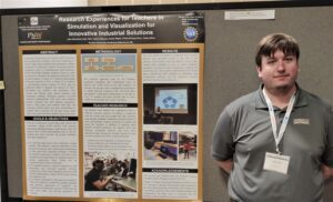 Kyle Toth, CIVS Senior Research Engineer, standing in front of a research poster