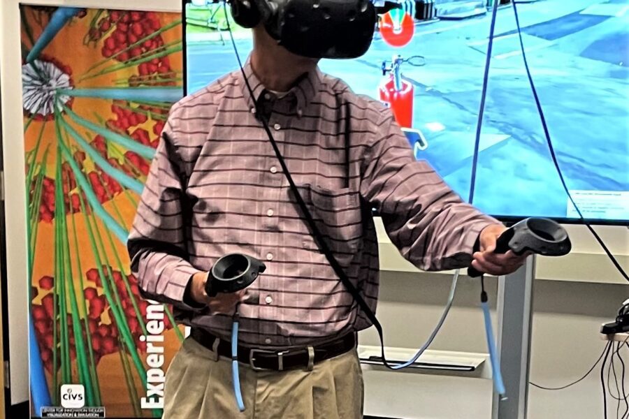Kelly Carmichael, Vice President of Federal Government Affairs, Environmental, and Sustainability at NiSource wearing a VR headset