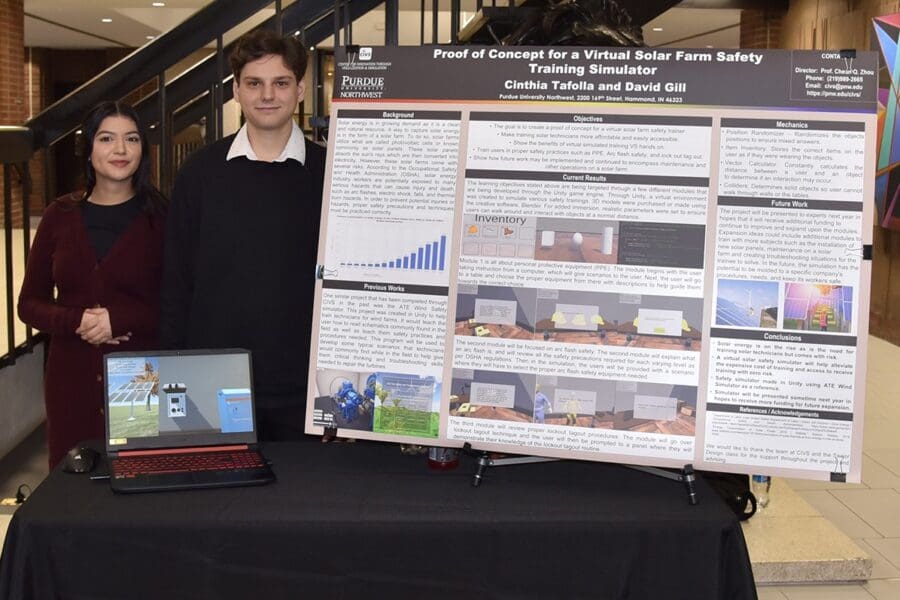 Students in a professional business attire standing in front of academic poster in presentation hall