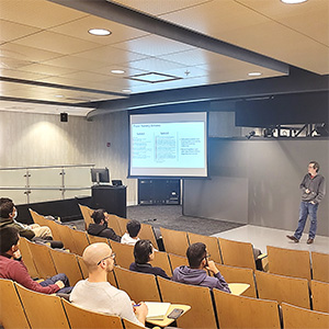 A researcher gives a presentation in a classroom