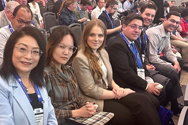 CIVS faculty and students pose together while sitting