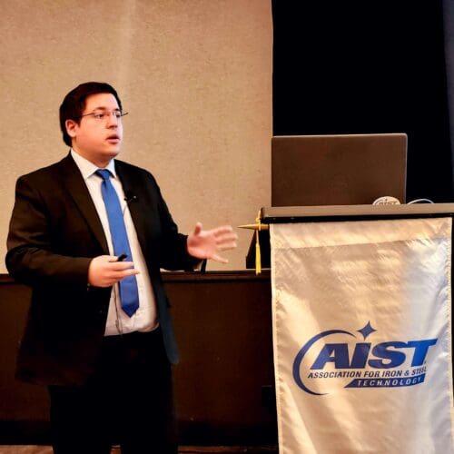 man presenting at a conference