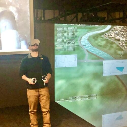 student demonstrates virtual reality headset