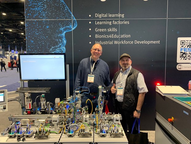 2 men standing with equipment