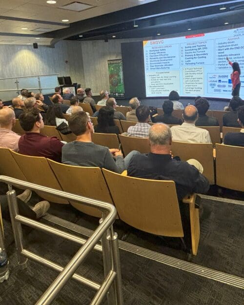 group of people listening to a presentation