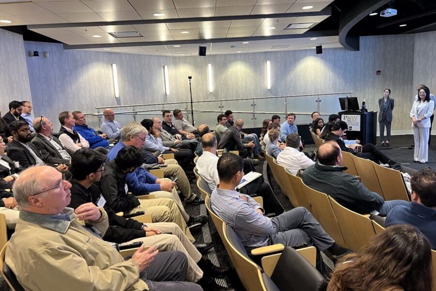 group of people listening to a presentation
