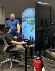 student demonstrating crane simulator
