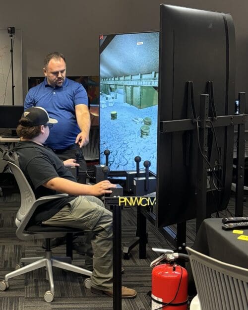 student demonstrating crane simulator
