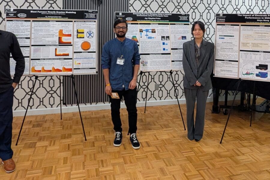 students standing with posters