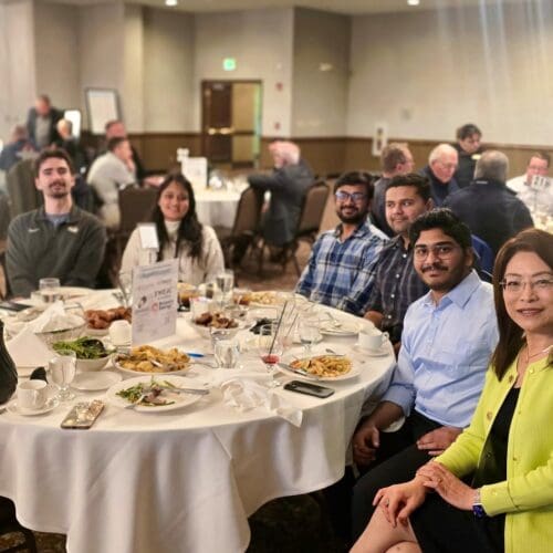 CIVS students and staff at a dinner table