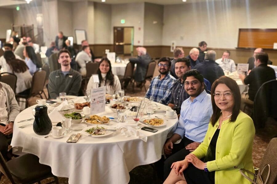 CIVS students and staff at a dinner table