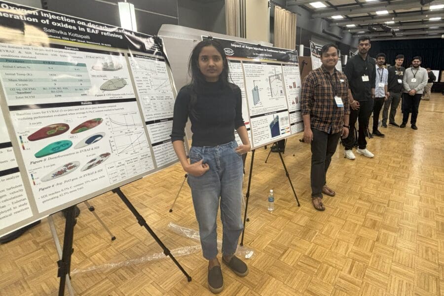 students standing with posters