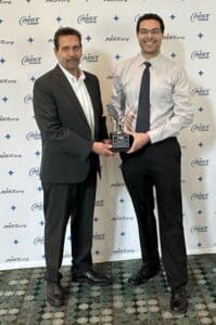 2 people holding an award