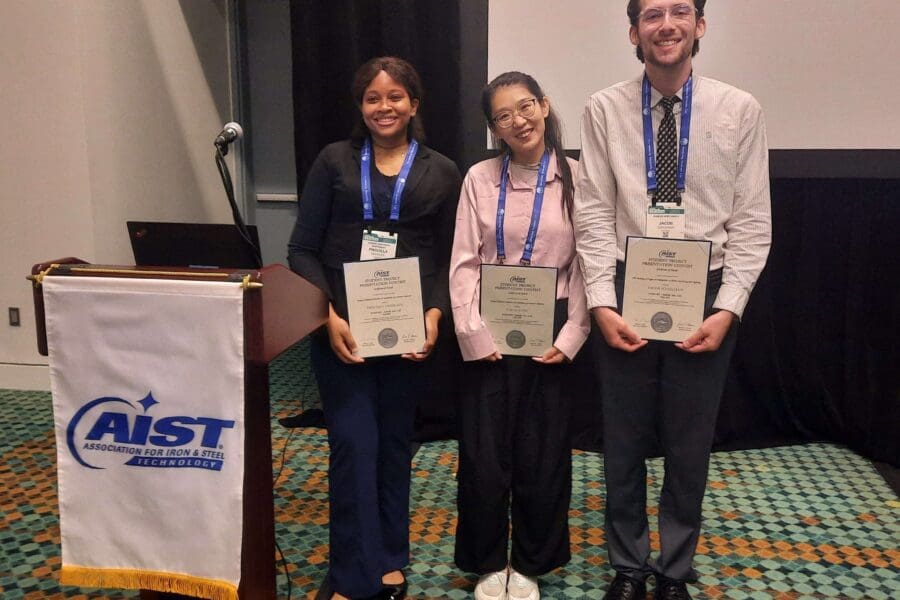 3 students with certificates