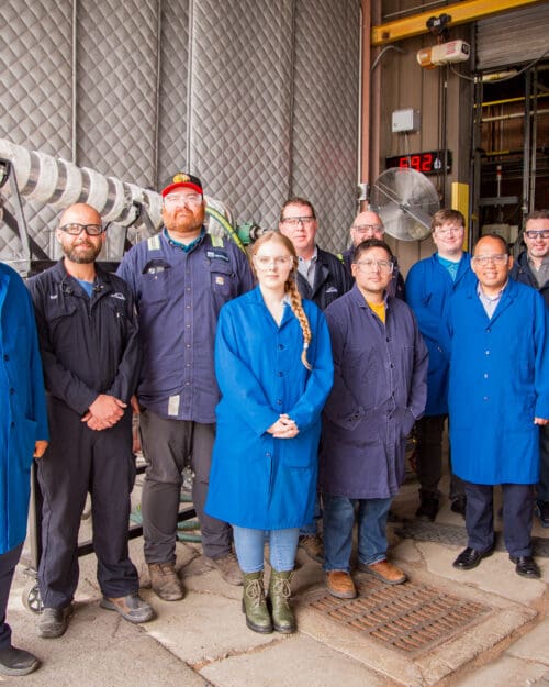 group of people at steel facility