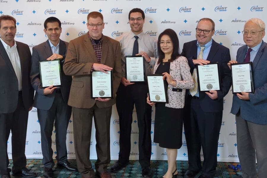 group of people holding certificates