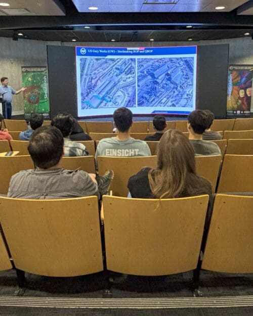 man giving lecture to students