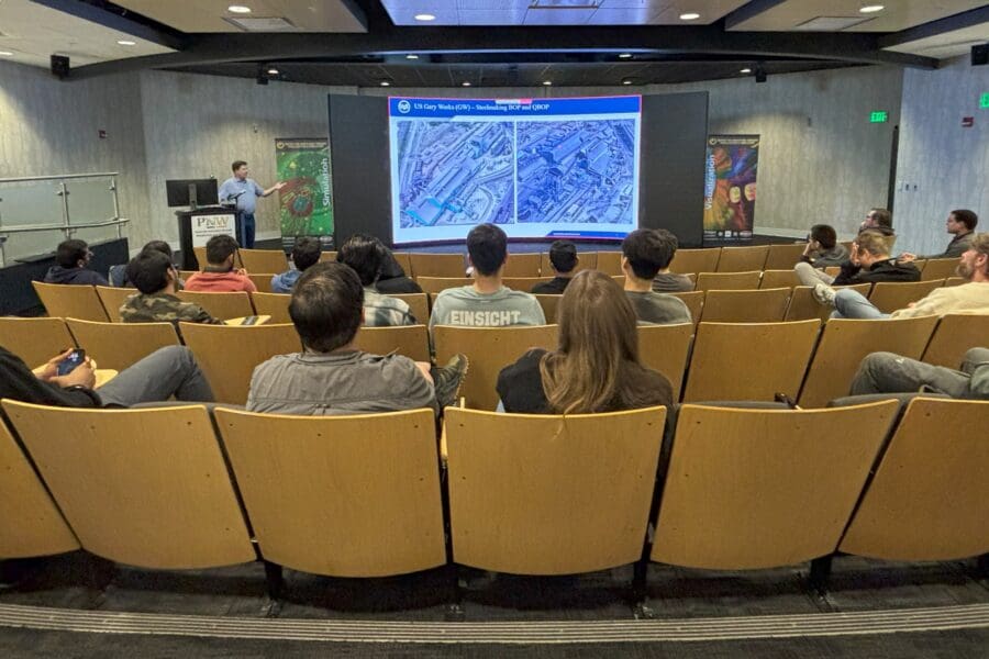 man giving lecture to students