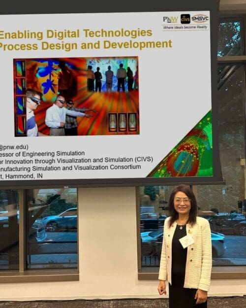 Chenn Zhou in front of screen