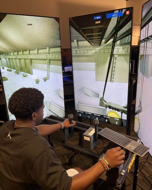 student operating crane simulator