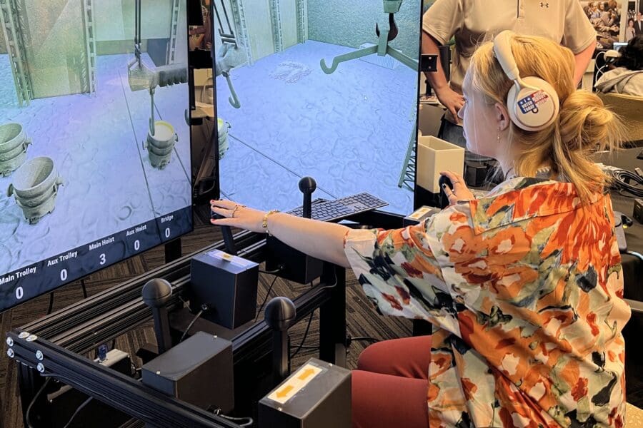student demonstrating crane simulator