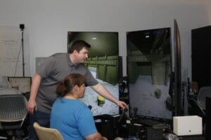 Woman demonstrating crane simulator
