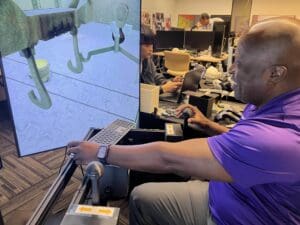 Man demonstrating crane simulator
