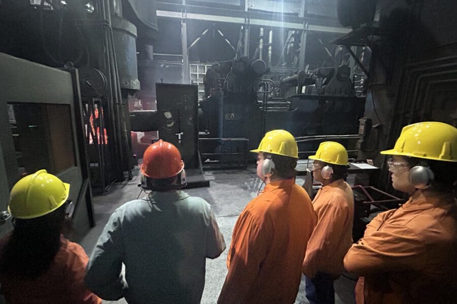 group of people at steel plant