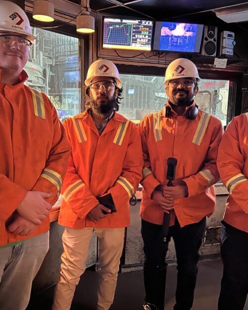 group of people at a steel plant